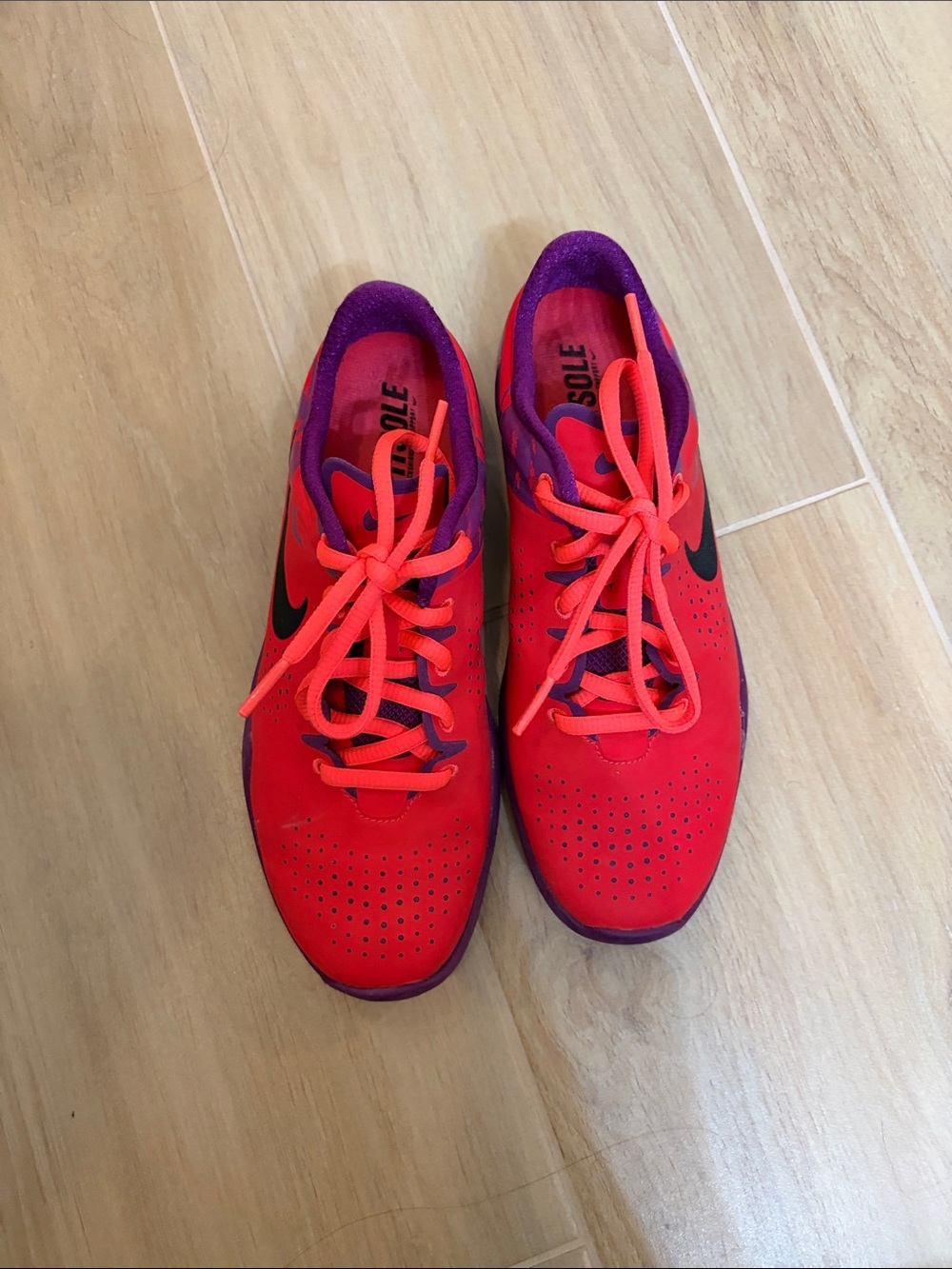 Nike Women’s Bright Red Athletic Sneakers with Purple Accents